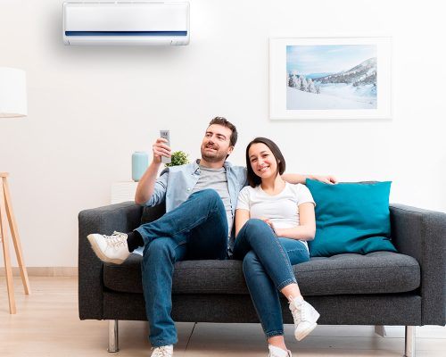 couple enjoying the air cnditioner