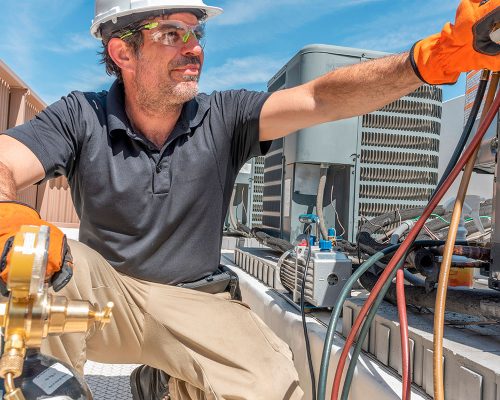 worker supervising the job for hvac